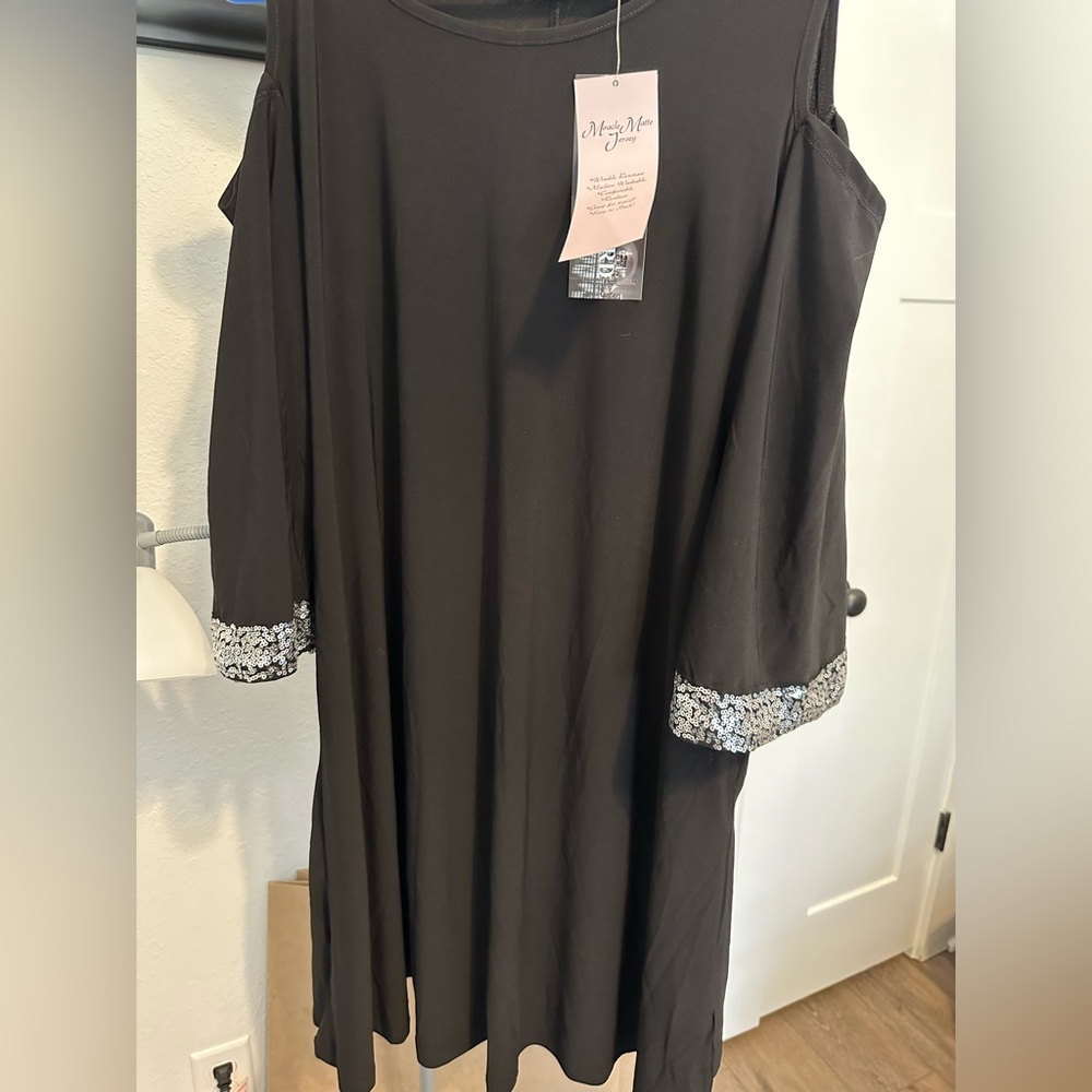 Cold shoulder black dress with silver accents on sleeves, polyester, mini